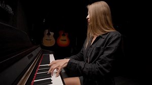 clip-1111494053-female-pianist-preparing-concert-playing-lyrical-melody