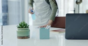 Woman, hands and cleaning desk in service for housekeeping, hygiene and dust on furniture. Cleaner, janitor or maid wiping dirt on table in workplace with cloth, spray bottle and office maintenance.