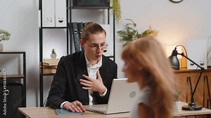 Caucasian dad father working from home with laptop having video call while little daughter having fun and playing around disturb at work, Busy businessman does office work on computer, Remote job.