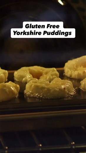 Gluten-free Yorkshire puddings that actually rise — this version uses cornstarch instead of flour and they come out light, crispy, and hollow just like the real deal. Crack 3 eggs into a measuring cup. Match that volume with cornstarch and the same amount of milk. Whisk until smooth — the batter should pour like loose cream. Heat oven to 450°F, fan off. Heat an empty muffin pan 10 min, add 2 tbsp oil per cup, and heat 10 more min until the oil is ripping hot. Fill each cup halfway. Bake 10–12 mi
