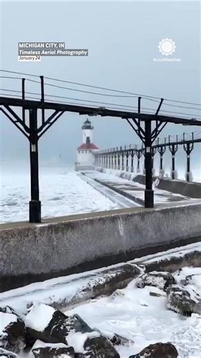 Icy waves surround the Michigan City Lighthouse as AccuWeather’s RealFeel® temperature drops to a bone-chilling 11° ❄️ | AccuWeather