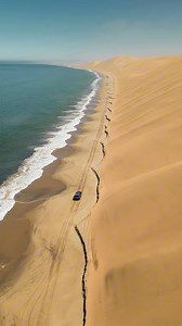 146K views · 1.4K reactions | This is Namibia’s surreal shoreline, where the desert kisses the ocean. ️ Golden dunes plunge into the Atlantic. Sunlight paints everything in its softest glow. Captured by DJI Mini 3 Pro. : IG/joshstrauss #DJI #DJIMini3Pro #DronePhotography #EpicViews #DesertOcean | DJI | Facebook