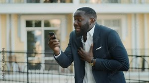 African american businessman having video chat outside. Afro man talking phone