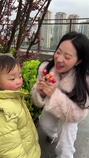 The younger sisters took the candy from the older sister and gave it to the little child!