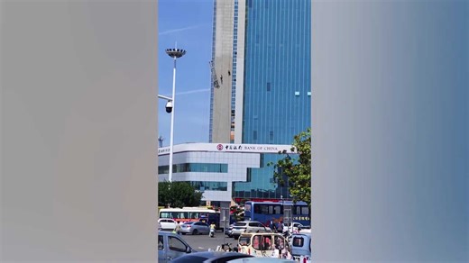 High-rise horror as workers dangle from bank tower after scaffold collapses