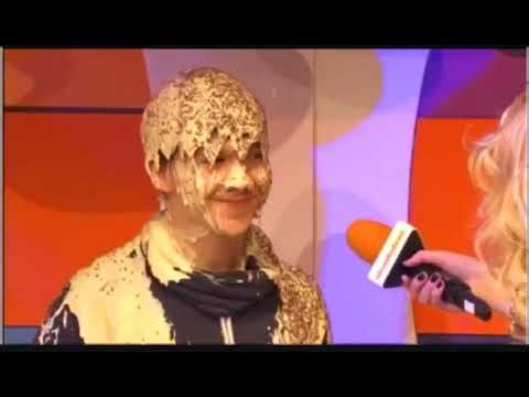 Young guy gunged with custard and chocolate sprinkles