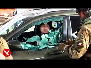 ICE agents smash window and drag man out of car during immigration raid