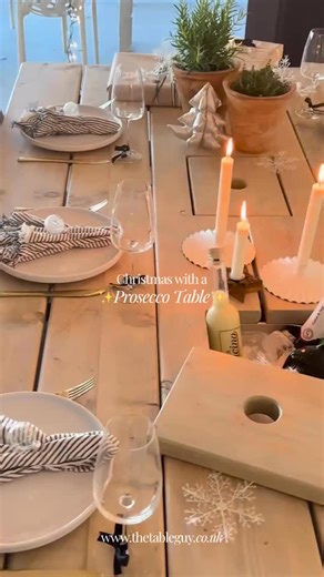 Nothing makes us happier than seeing our Prosecco Table dressed for Christmas — bottles tucked into the ice bucket, candles glowing, and the whole room ready for festive cheer. 🎄🕯️ | The Table Guy