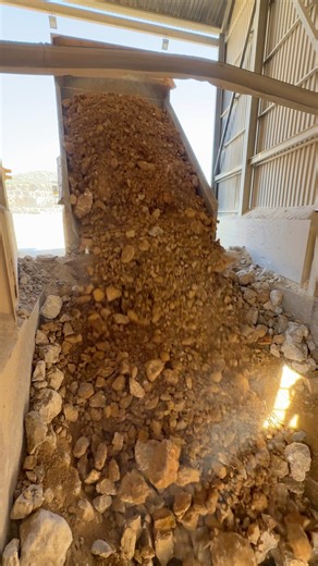 Full rigid dump truck load into a static primary crusher. | Awesome Earthmovers