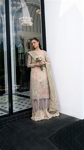 MYSIE BY TAHIRA on Instagram: "Insha – Aurea’25 Insha is a poetic blend of soft festivity and modern elegance—crafted with a delicate harmony of luxurious textures. The tissue shirt glows in dreamy lilac and pink-hot pink gradients, creating a romantic play of color that shifts beautifully with the light. Paired with a gracefully draped organza dupatta, the ensemble embodies refinement, femininity, and effortless charm. The pastel-to-bold palette enhances the outfit’s youthful yet regal aura, wh