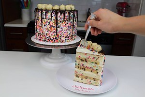 My sister's birthday is this week, and she asked for something with edible cookie dough! She also loves sprinkles, so a funfetti cookie dough cake seemed like the right move this year. I used my go to vanilla layer cake recipe 3/4 cup of rainbow jimmies to create the layers, and I made one batch of my vanilla buttercream and edible cookie dough to fill the cake. The recipes can be found below: Vanilla Cake Recipe: https://chelsweets.com/2016/09/05/best-vanilla-layer-cake-recipe/ Vanilla Buttercr