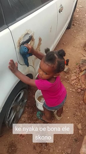 Young Child Washing a Car: Cute Cleaning Moments