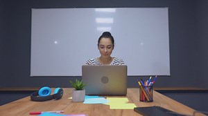 Woman working on a computer in a boardroom - Free Stock Video