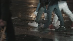Crossing a wet road at night - Free Stock Video