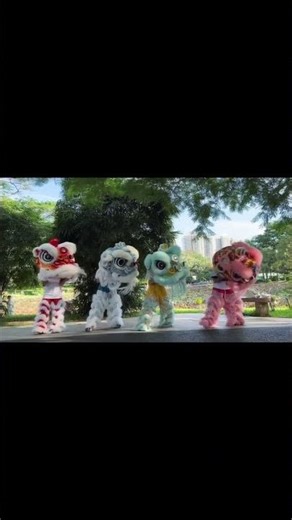 The lion dancers hit every move together — crisp, clean, and totally in sync.