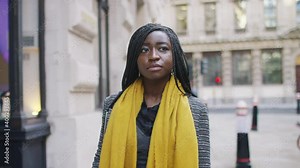Young black female walking through the city