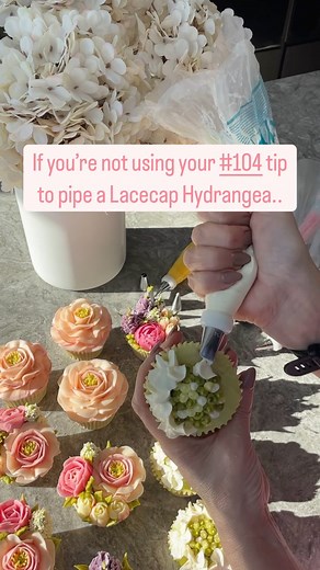 Don’t just use #104 nozzle to pipe mini buttercream roses. Try this Lace cap Hydrangea. 🧁Visit our website (icingonthecakeschool.com) for video tutorials to get you started or DM to find out what in person buttercream flowers classes we have available to book now in Kent. ❤️ Make sure you are following @icingonthecakeschool for easy to implement piping tips and ideas. 📌 Save this video so you know where to find it later! ❤️ Share with someone that needs it! | Icing On The Cake School