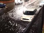 Cars bravely driving through a notorious huge puddle in Sutton