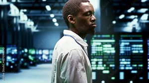 System administrator monitoring supercomputer cybersecurity threats arising due to unsecured network connections. Supervisor making sure server hub is invulnerable to DDoS attacks