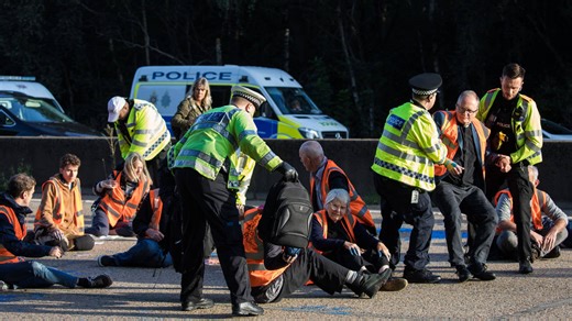 Man and woman arrested on suspicion of organising eco protests that caused mayhem on M25 | LBC