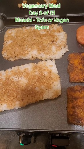 Veganuary Meal- Day 8 of 31 - Tofu or Plant-Based Spam Musubi. I had Tofu. She shaped cooked rice into blocks, put soy sauce on them and put them on our indoor griddle. Lastly wrapped them in seaweed. Oh my goodness, thus was so good. #veganuary #musubi #tofu #plantbasedspam #seaweed