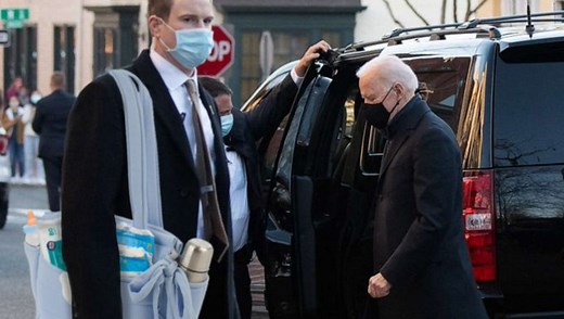 Secret Service Agent Caught Carrying Joe Biden's Diaper Bag? Viral Photo Fuels Conspiracy Theory