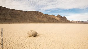 Time lapse of the clouds above the famous moving rocks on the Race Track dry lake in Death Valley
