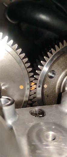 checking the timing mark on camshaft gear. #mechanic
