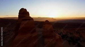 Timelapse of shifting shadows and hues in a rocky desert landscape as the sun makes its journey across the sky.