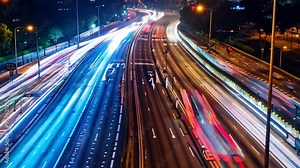 Night city traffic blurred cars long exposure lights evening highway lane movement fast transit car motion auto illuminated vehicle transportation street high speed light trails abstract background