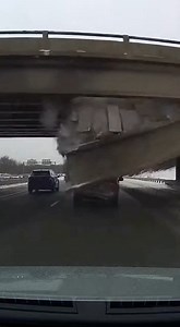 A bridge in China partially collapsed in dramatic fashion, sending debris and dust pouring onto the roadway below, yet by a remarkable stroke of luck, no one was injured, according to video circulating online. Footage from the scene shows a sudden structural failure as large sections of the bridge give way, collapsing downward and filling the area beneath with thick clouds of dust and concrete fragments. Vehicles can be seen stopped nearby, narrowly avoiding the falling debris as the collapse un