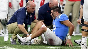 Corral is carted off the field after injuring his leg in Sugar Bowl