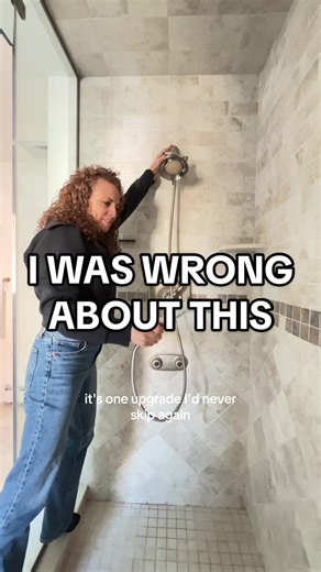 I was wrong about this bathroom design choice. We skipped a handheld in our walk-in shower years ago. Cleaning with buckets was not the move. Adding a handheld diverter is something I’d never skip again during a bathroom remodel. #bathroomremodel #walkinshower #designmistakes #newhomeowner #doasisaynotasido