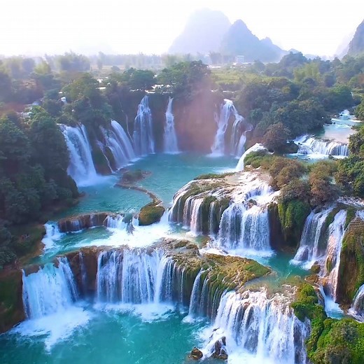 Straddling the border of China and Vietnam is this gorgeous set of converging waterfalls. | Travel Leisure