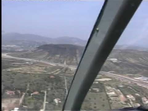 Bell 206 low heli flight over mainland