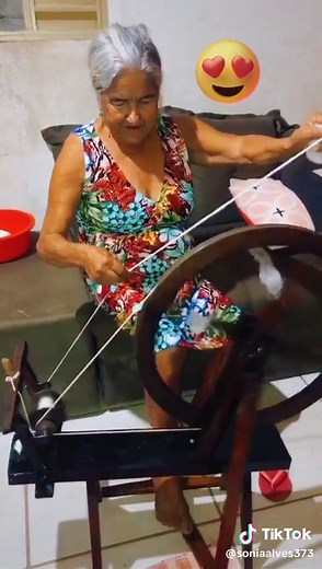 Traditional Spinning Wheel Demonstration by Elderly Woman