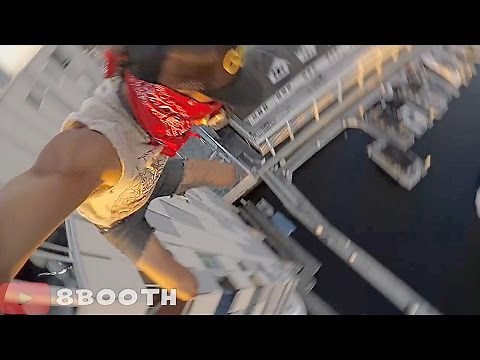 Watch Crazy Daredevil Jump Off 8 Story Building, Nearly Gets Killed
