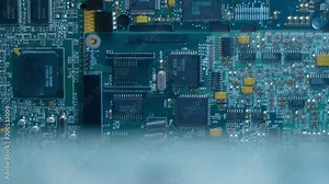 Electronic boards with many different microcircuits and other radio components show the complexity of the products of the modern electronics industry. Closeup. Macro. Shot in motion