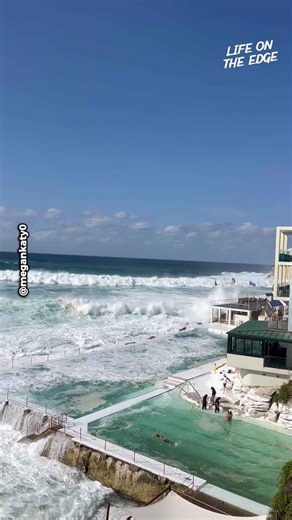 Powerful Wave Crashes Into Swimmers at Famous Beach