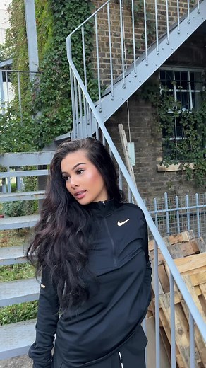 Standing on Staircase: Stylish Look Outside Building