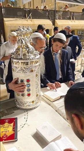 Jews celebrate the Simchat Torah holiday at the Western Wall in Jerusalem, Israel, in 2025
