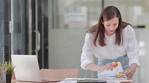 Young Happy Beautiful Businesswoman Working in Modern Office. Beautiful Manager Smiling, Working on Financial, Marketing Projects Operations, Analysing Statistics, Commerce Data, Marketing Plans.