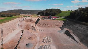 Large deep open cast mine from bird's eye view. Ilmenite ore quarry. Mining pit