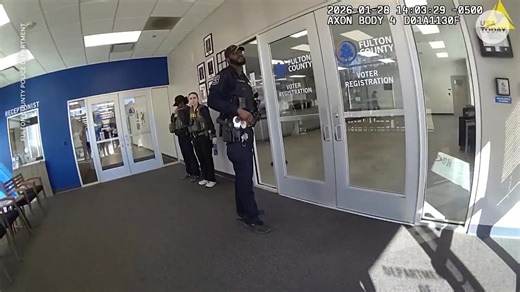 Bodycam released by the Fulton County Police Department shows initial warrant confusion at a Georgia election facility when the FBI arrived to seize files, including physical ballots, ballot images and voter rolls. | USA TODAY Video