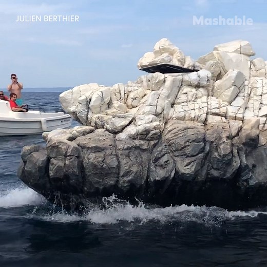 This floating rock is actually a perfectly camouflaged boat. | Mashable