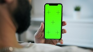 Man touching mobile phone greenscreen - Free Stock Video