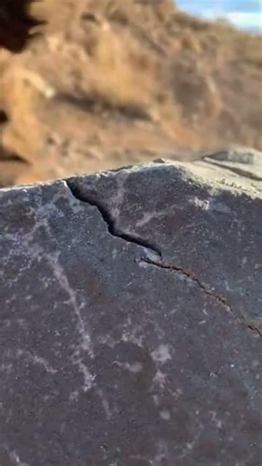 Opening a malachite stone to reveal its patterns