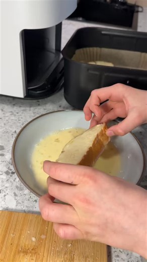 Benito Fonseca on Instagram: "Air Fryer French Toast Whisk together 1 egg, a splash of milk, and 2 tablespoons of sugar. Dip a sweet bun or slice of bread into the mixture on both sides. Air fry at 190°C / 375°F — 5 minutes on one side, flip, then another 5 minutes. Enjoy warm — optionally top with honey, cinnamon, or your favorite syrup! #airfryerrecipes #airfryercooking #cosori"