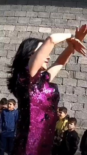 Captivating Dance Performance in Sparkling Purple Dress