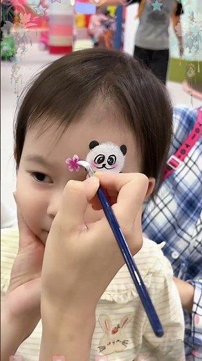 Panda face painting is incredibly adorable and calming!
